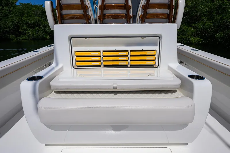 Slide: The Image of 2025 Valhalla V-37 boat seating with integrated storage and cup holders. - 37