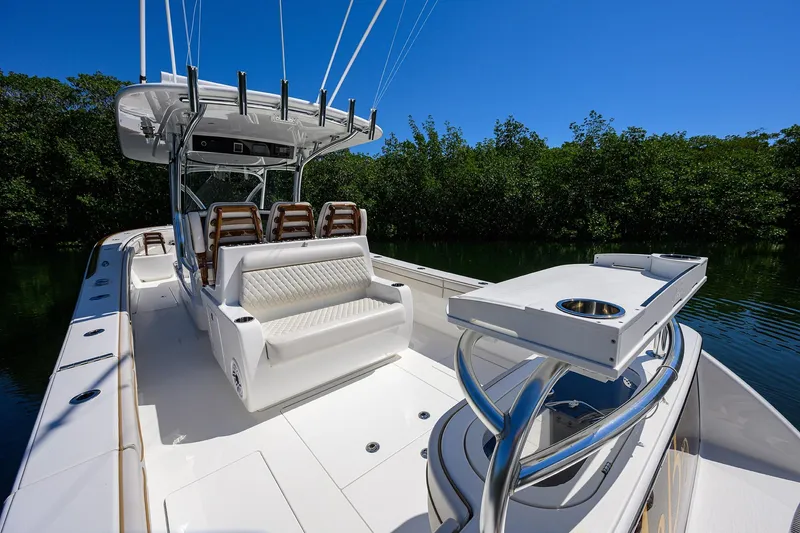 Slide: The Image of 2025 Valhalla V-37 boat interior with seating and fishing rod holders. - 38