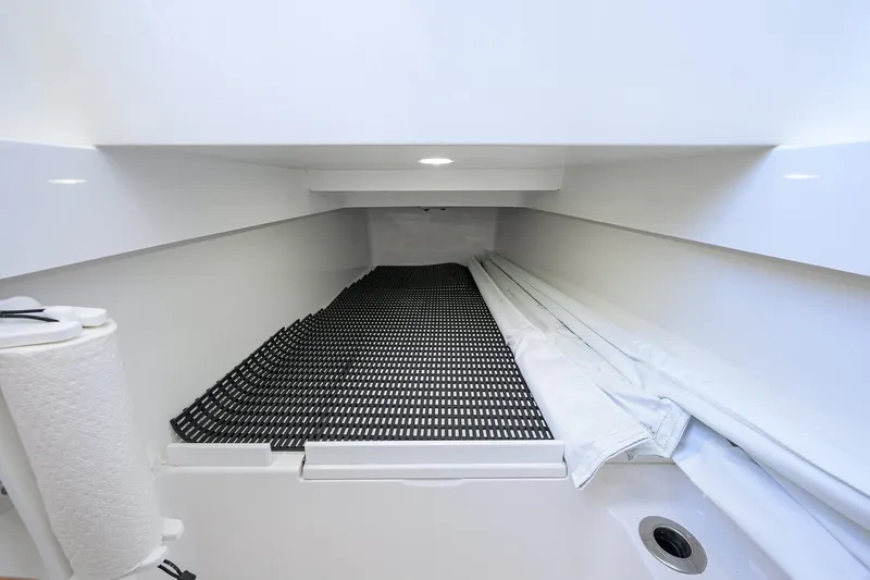 Slide: The Image of Interior storage space of 2025 Valhalla V-37 boat, featuring organized compartments. - 52