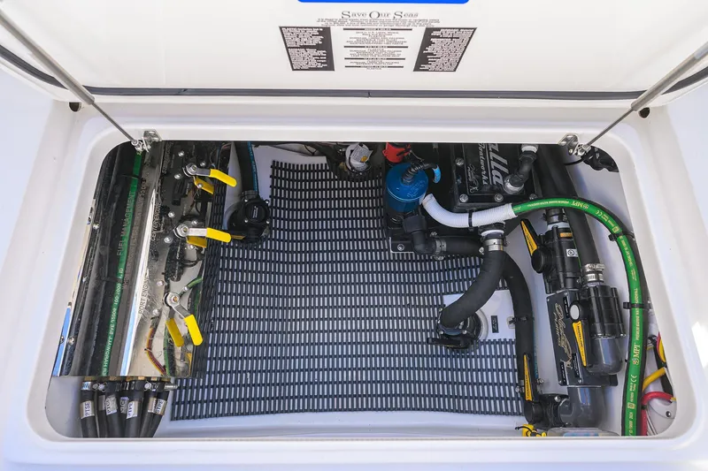 Slide: The Image of Engine compartment of 2025 Valhalla V-37 boat with visible hoses and components. - 54