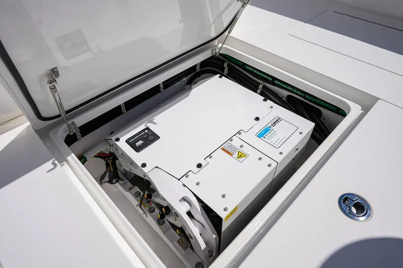 Slide: The Image of Open hatch revealing electrical system in 2025 Valhalla V-37 boat. - 58
