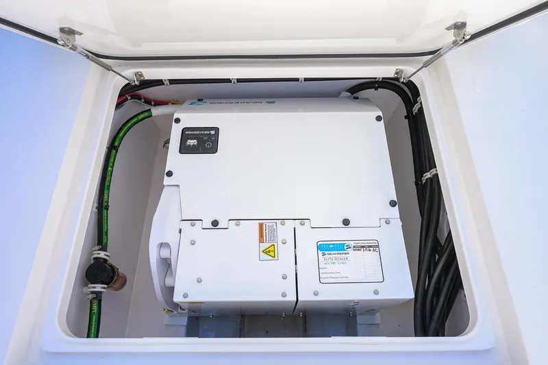 Slide: The Image of 2025 Valhalla V-37 engine compartment with Seakeeper system and wiring. - 59