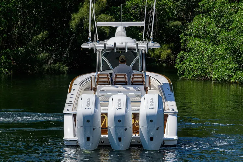 Slide: The Image of 2025 Valhalla V-37 boat with four powerful engines cruising on a serene waterway. - 9