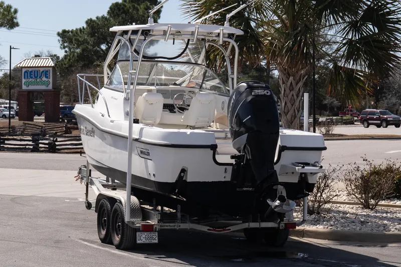 Slide: The Image of 2005 Boston Whaler 235 Conquest boat on trailer near Neuse Sport Shop. - 5