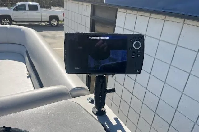 Slide: The Image of Fishfinder on 2023 Godfrey Sweetwater 2286 FS boat, parked near a white truck. - 10