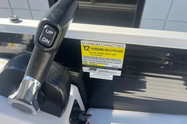 Slide: The Image of Control panel of 2023 Godfrey Sweetwater 2286 FS with capacity label for 12 persons. - 11