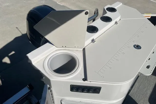 Slide: The Image of 2023 Godfrey Sweetwater 2286 FS boat console with cup holders and Yamaha engine. - 13