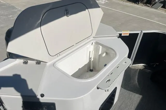 Slide: The Image of Open storage compartment on 2023 Godfrey Sweetwater 2286 FS boat. - 14
