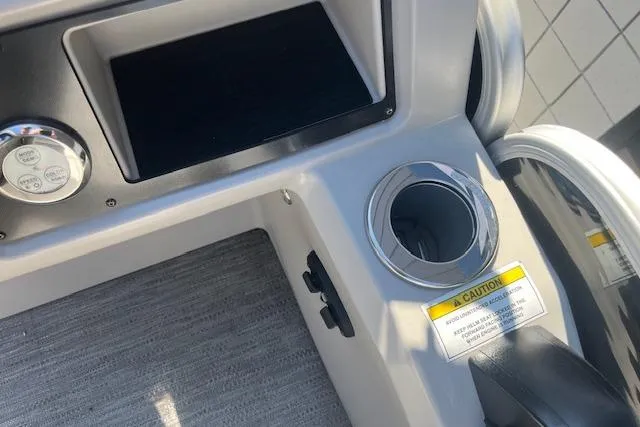 Slide: The Image of 2023 Godfrey Sweetwater 2286 FS boat console with cup holder and control panel. - 9