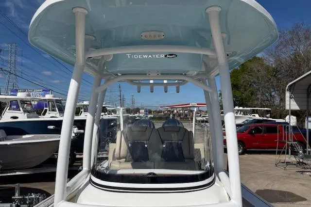 Slide: The Image of 2022 Tidewater 2700 Carolina Bay boat with T-top, parked in a dealership lot. - 16