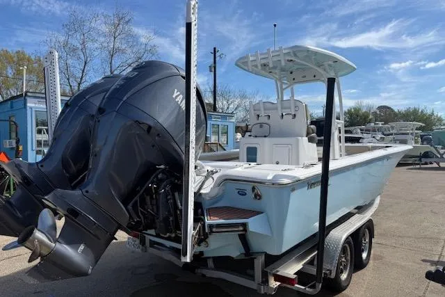 Slide: The Image of 2022 Tidewater 2700 Carolina Bay boat with dual Yamaha engines on a trailer. - 5