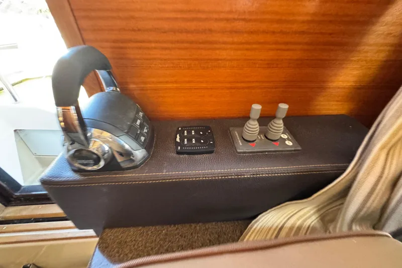 Slide: The Image of Control panel of 2019 Ranger Tugs R-31 CB with joystick and throttle levers. - 21