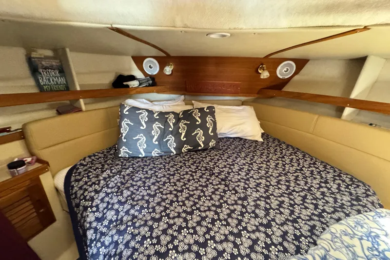 Slide: The Image of Cozy cabin interior of 2019 Ranger Tugs R-31 CB with nautical-themed bedding. - 29