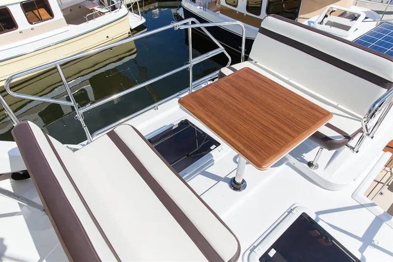 Slide: The Image of Manufacturer Provided Image: 2019 Ranger Tugs R-31 CB boat deck with seating and table. - 8