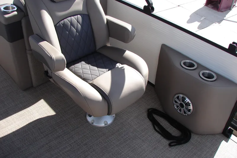 Slide: The Image of Luxurious seating on 2019 Bennington SX 25 SCWXP boat with cup holders and speaker. - 22