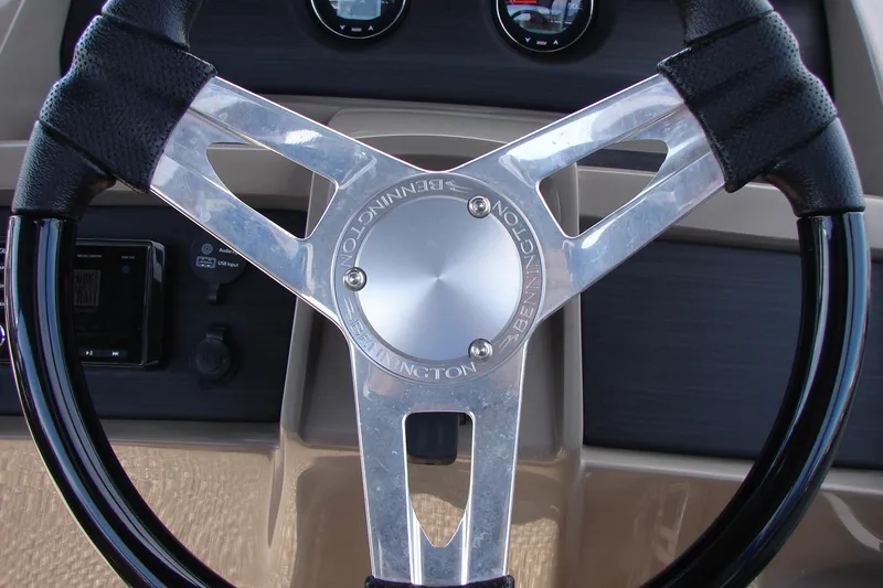 Slide: The Image of Steering wheel of 2019 Bennington SX 25 SCWXP boat, featuring sleek design and controls. - 26