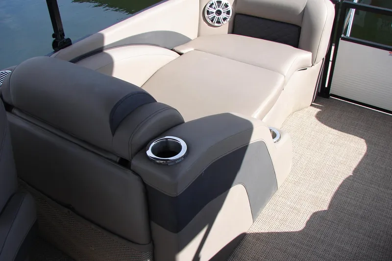 Slide: The Image of 2019 Bennington SX 25 SCWXP boat interior with comfortable seating and cup holders. - 28