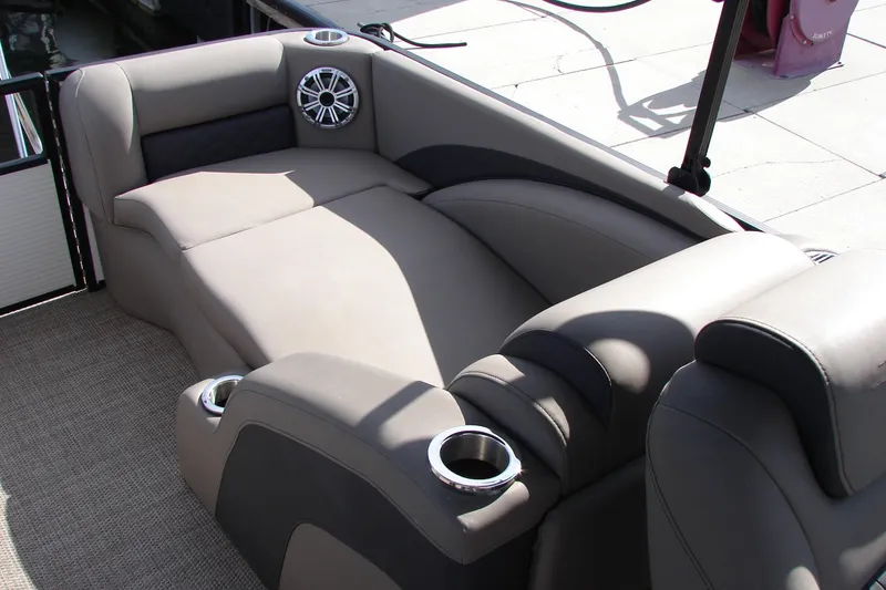 Slide: The Image of Luxurious seating on 2019 Bennington SX 25 SCWXP boat with cup holders and speaker. - 29
