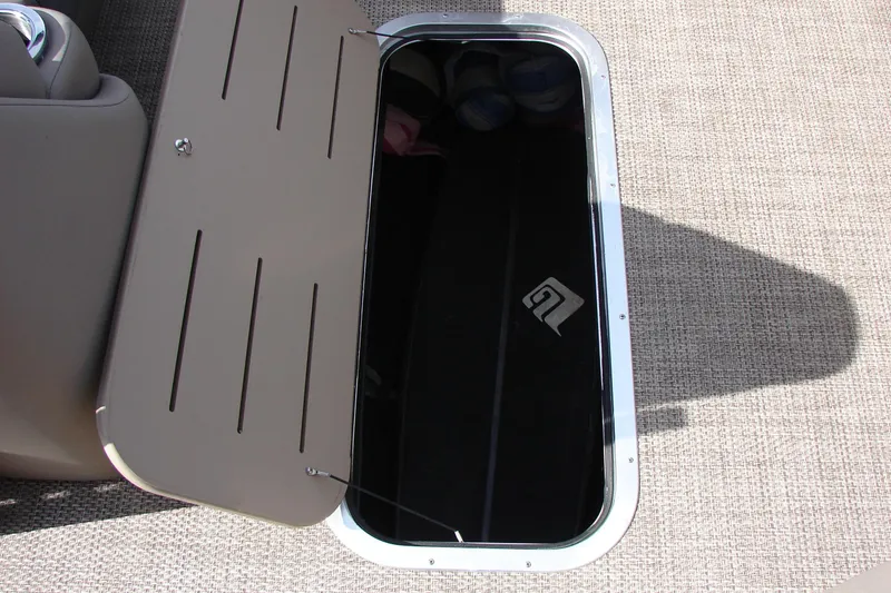 Slide: The Image of Open storage compartment on 2019 Bennington SX 25 SCWXP boat deck. - 34