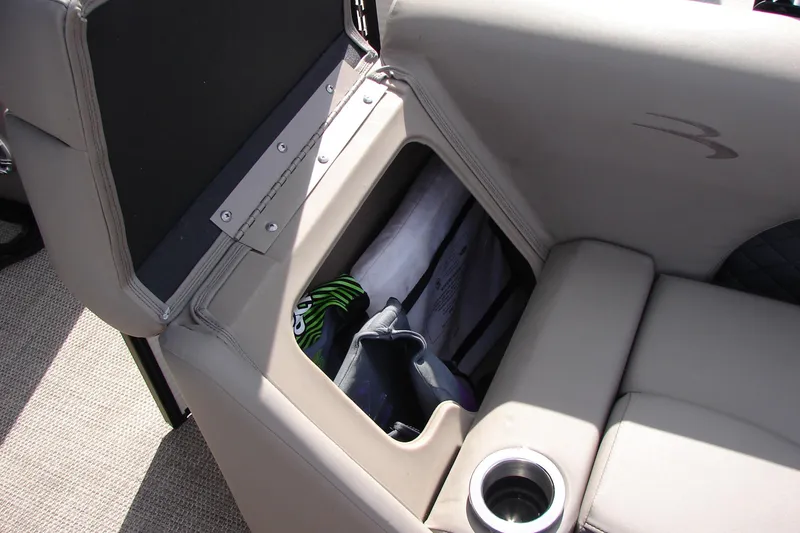 Slide: The Image of 2019 Bennington SX 25 SCWXP boat seat storage with cup holder and gear. - 35