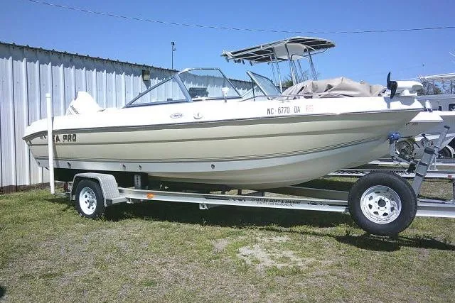 The Image of 2005 Sea Pro 195 Fish & Ski boat on trailer, parked outdoors. - 0