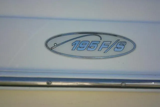 Slide: The Image of 2005 Sea Pro 195 Fish & Ski boat logo on white surface. - 10