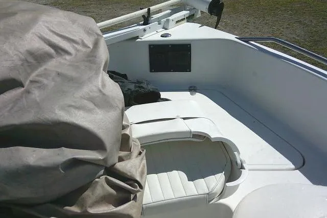 Slide: The Image of 2005 Sea Pro 195 Fish & Ski boat interior with covered seating area. - 13