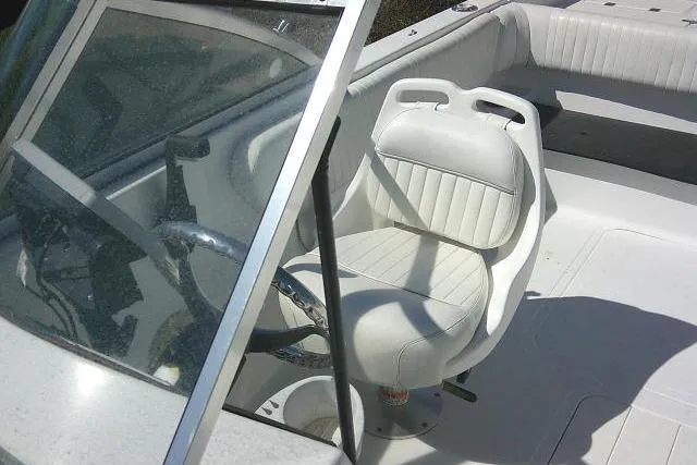Slide: The Image of 2005 Sea Pro 195 Fish & Ski boat interior with steering wheel and seating. - 14