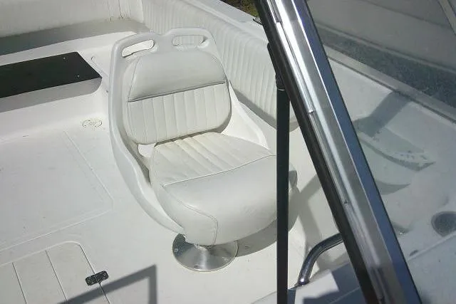 Slide: The Image of 2005 Sea Pro 195 Fish & Ski boat interior with white seating and windshield. - 15