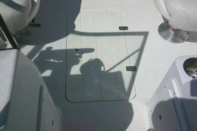 Slide: The Image of 2005 Sea Pro 195 Fish & Ski boat interior with seating and storage hatch. - 16