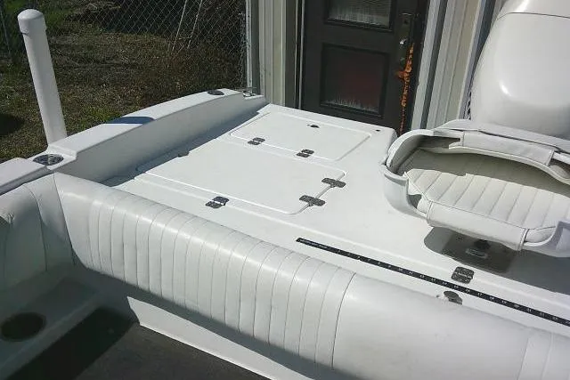 Slide: The Image of 2005 Sea Pro 195 Fish & Ski boat interior with white seating and storage compartments. - 18
