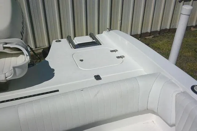 Slide: The Image of 2005 Sea Pro 195 Fish & Ski boat interior with white seating and storage compartment. - 19