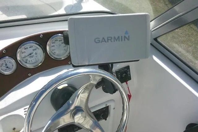 Slide: The Image of Steering wheel and Garmin GPS on 2005 Sea Pro 195 Fish & Ski boat dashboard. - 22