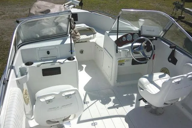 Slide: The Image of 2005 Sea Pro 195 Fish & Ski boat interior with steering wheel and seating. - 24
