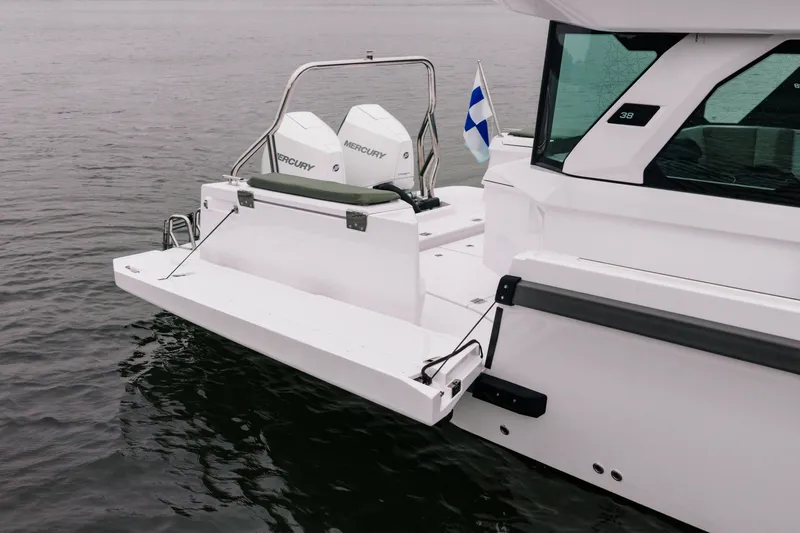 Slide: The Image of 2026 Axopar 38 Cross Cabin boat with dual Mercury engines on water. - 8