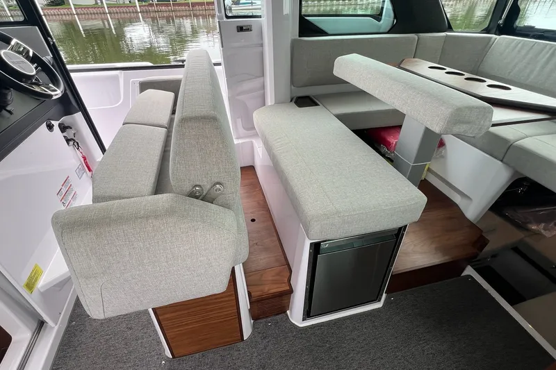 Slide: The Image of Interior of 2027 Axopar 38 Cross Cabin with modern seating and sleek design. - 13