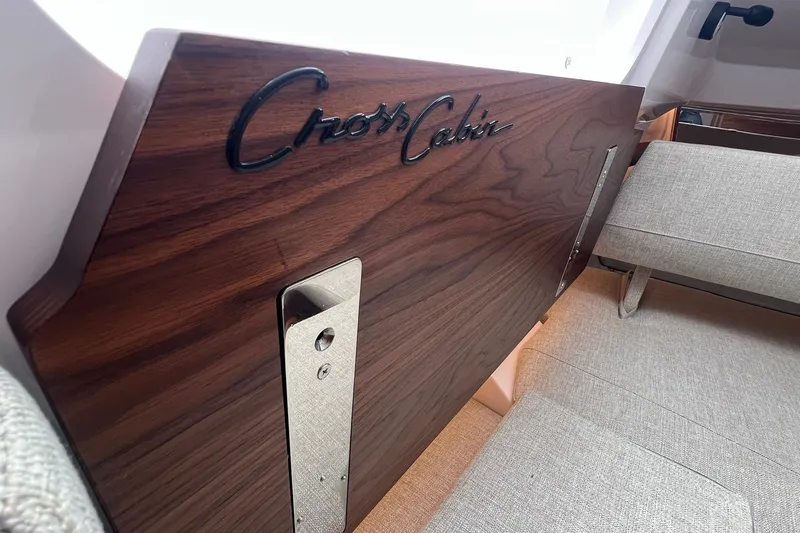Slide: The Image of 2027 Axopar 38 Cross Cabin interior with wood finish and seating. - 23