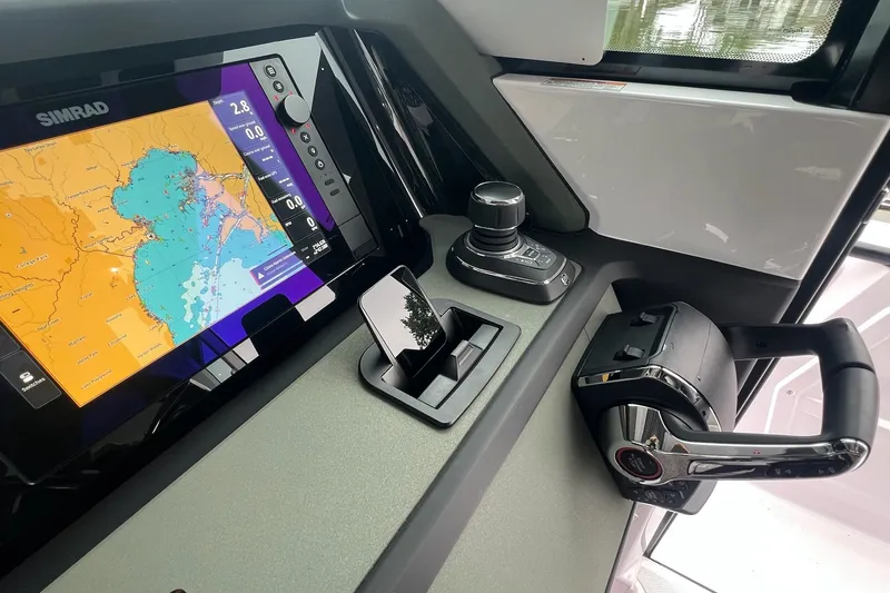 Slide: The Image of Control panel of 2027 Axopar 38 Cross Cabin with Simrad navigation display. - 19