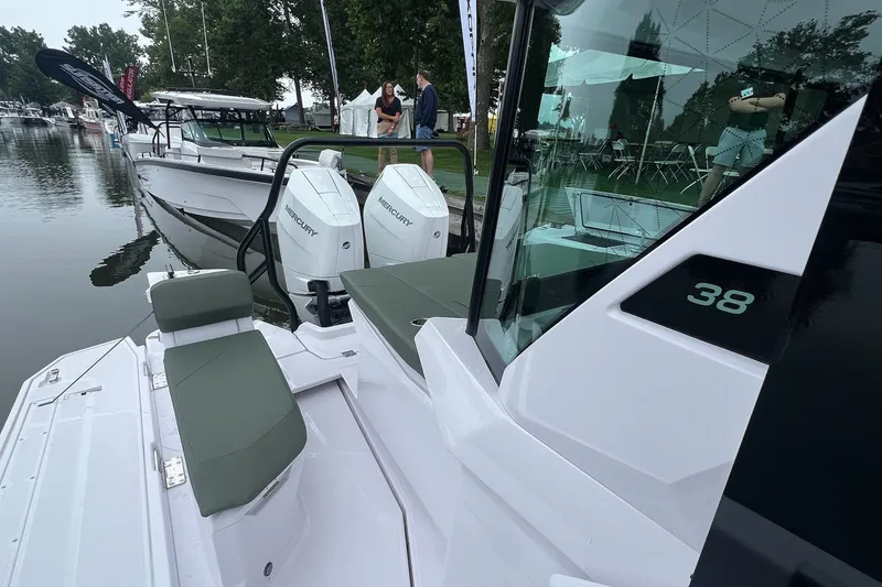 Slide: The Image of 2027 Axopar 38 Cross Cabin boat docked with Mercury engines, featuring sleek design. - 39