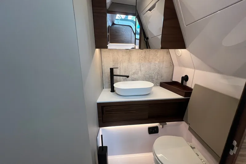 Slide: The Image of Modern bathroom interior of 2027 Axopar 38 Cross Cabin boat, featuring sleek fixtures and elegant design. - 28