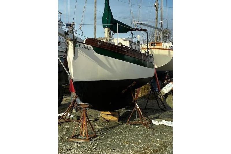 Slide: The Image of 1982 Falmouth Cutter 22 sailboat on stands, ready for maintenance. - 7