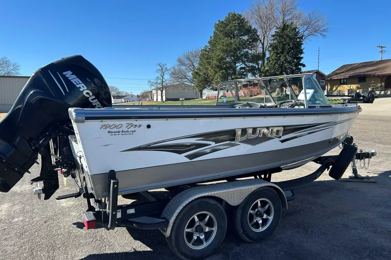 Slide: The Image of 2015 Lund 1900 Tyee boat on trailer with Mercury outboard motor. - 3