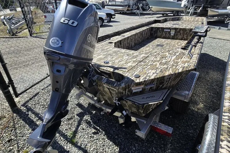 Slide: The Image of 2025 Avid 16 Commander boat with camouflage design and 60 HP outboard motor. - 4