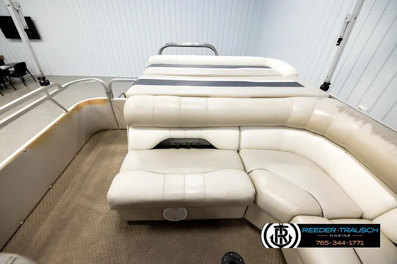 Slide: The Image of 2004 Smoker Craft 820 Infinity Cruise boat interior with beige seating and carpet flooring. - 15