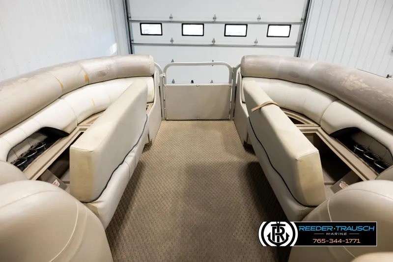 Slide: The Image of Interior of 2004 Smoker Craft 820 Infinity Cruise pontoon boat with beige seating. - 19
