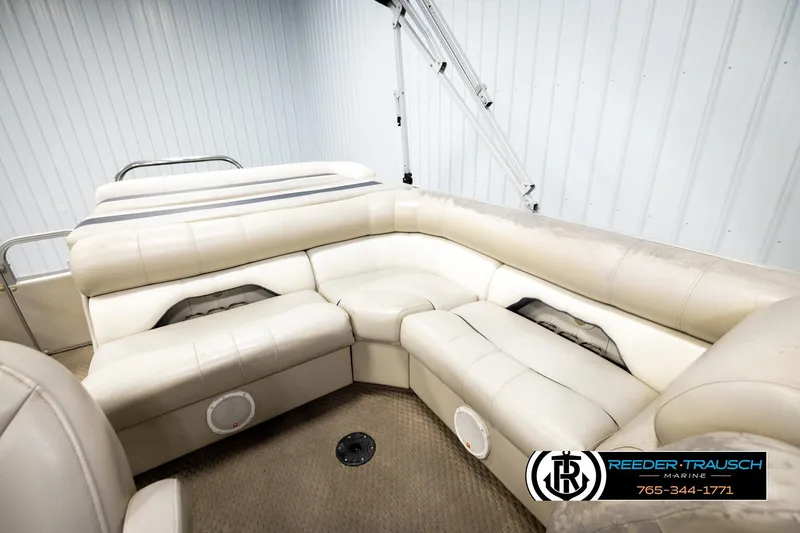 Slide: The Image of 2004 Smoker Craft 820 Infinity Cruise boat interior with beige seating and carpeted floor. - 22