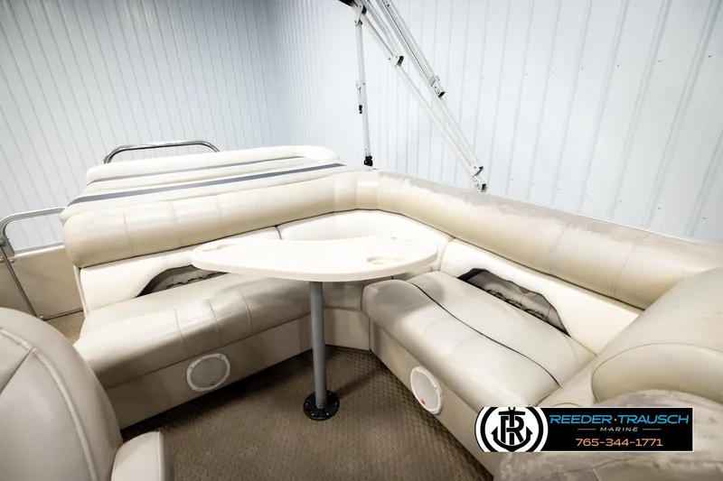 Slide: The Image of 2004 Smoker Craft 820 Infinity Cruise boat interior with beige seating and table. - 23