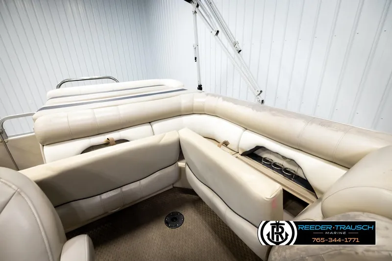 Slide: The Image of 2004 Smoker Craft 820 Infinity Cruise boat interior with beige seating and cup holders. - 24