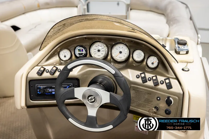 Slide: The Image of Steering console of 2004 Smoker Craft 820 Infinity Cruise boat with gauges and controls. - 26