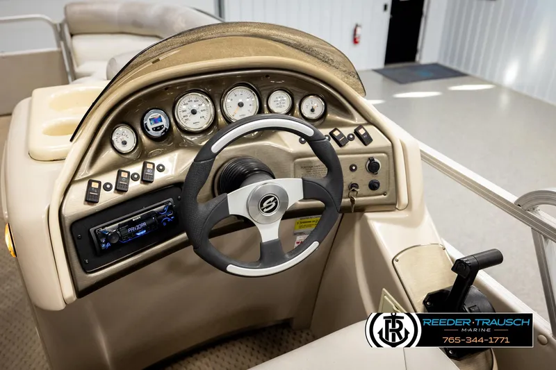 Slide: The Image of 2004 Smoker Craft 820 Infinity Cruise dashboard with steering wheel and control panel. - 27